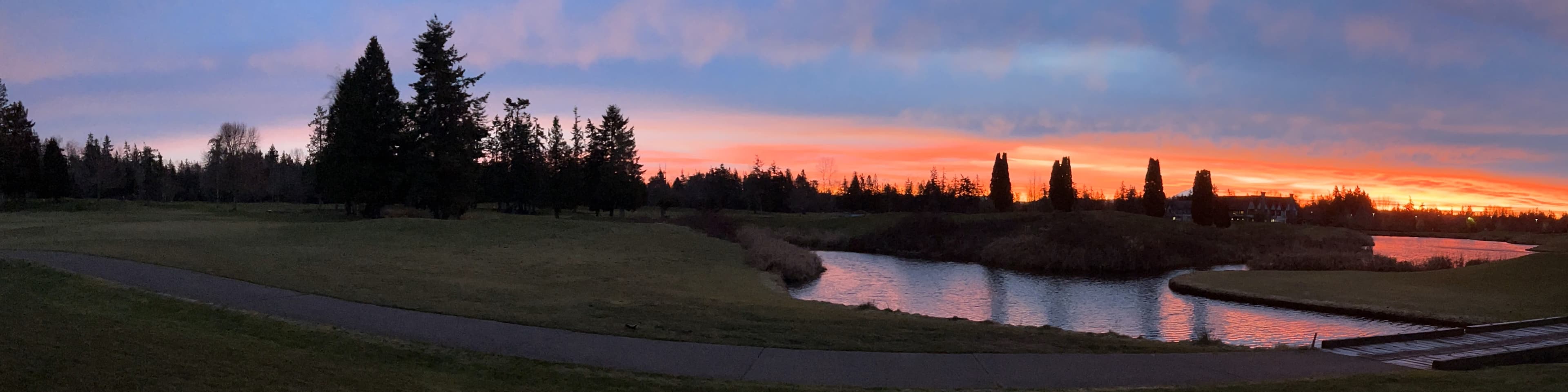 sunset over a golf course